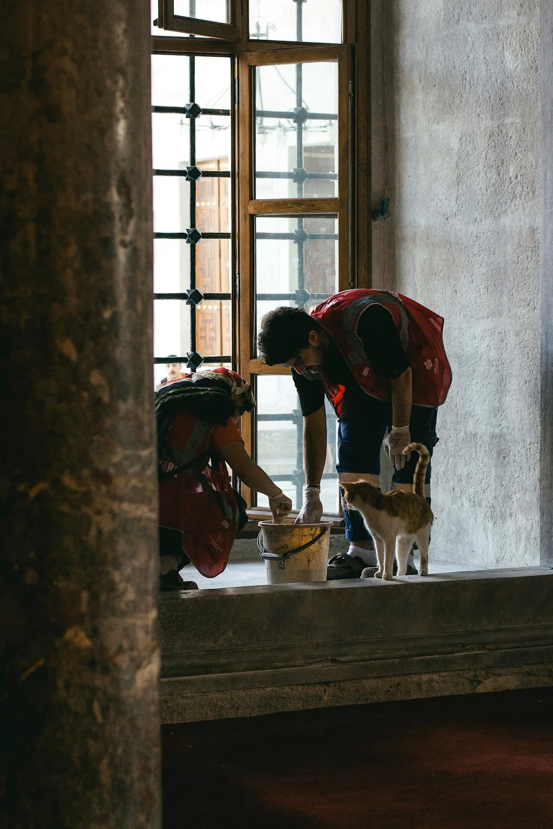A person in full protective gear fumigating a room to ensure sterilization against viruses.